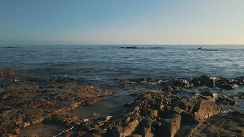 Cinemagraph loop of ocean waves with a clear sky Stock Footage 142555719