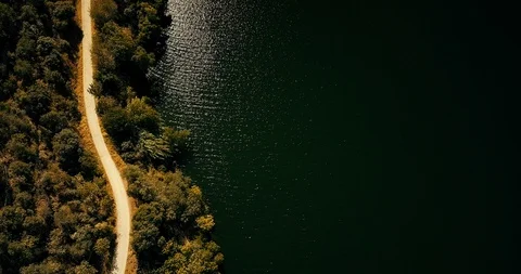 Cinemagraph Loop - Road by the River from Above - motion photo Stock Footage 98710159