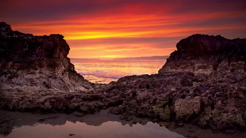 Cinemagraph Loop - Rocky Beach, Red Sunset - motion photo Stock Footage 98713201
