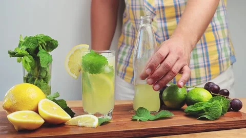Cinemagraph, loop seamless motion of lemonade in a bottle and carbonated bubbles Stock Footage 158889714