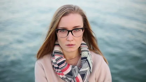 Cinemagraph. Loop video. Live photo. Beautiful blonde girl with glasses and Stock Footage 141285154