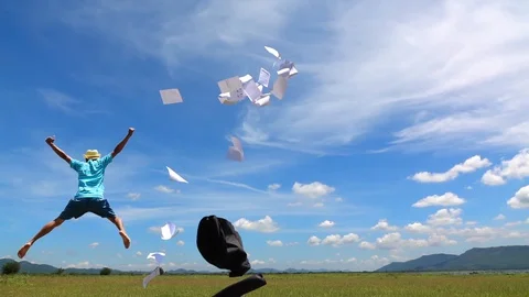 Cinemagraph of a man jumping and cloud sky time lapse. Stock Footage 108778616