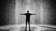 Cinemagraph Of Man Standing In The Rain With Arms Out Stretched Stock Footage