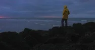 Cinemagraph Man Standing On The Rocky Pier, Enjoying Sunset Over Sea Stock Footage