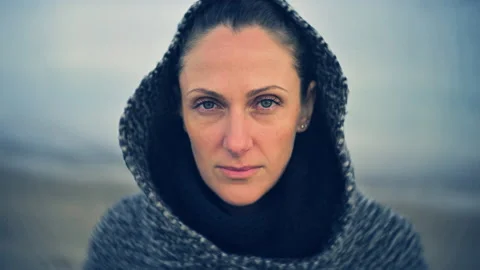 Cinemagraph motion loop portrait shot Beautiful caucasian woman with  coat hood Stock Footage 152337874