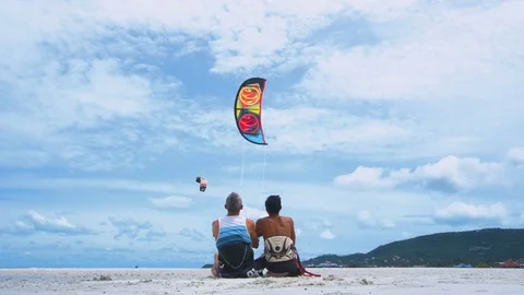 Cinemagraph of People Learning to Operate Kite Stock Footage 79846996