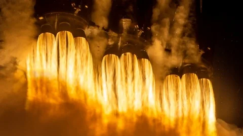 Cinemagraph of rocket engines taking off at night from launch pad Stock Footage