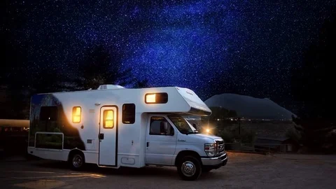 Cinemagraph of RV camping at night with moving stars Stock Footage