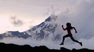 Cinemagraph - Seamless Loop. Trail Runner Athlete Silhouette Running In Mountain Stock Footage