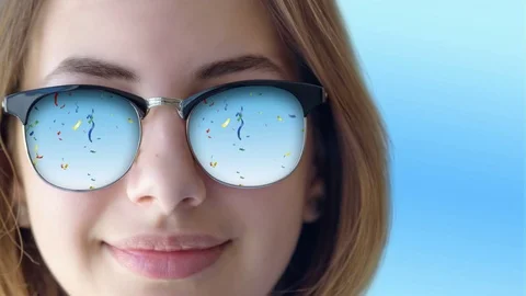 Cinemagraph -Serpentines reflected in young beautiful girl's sunglasses. 動画素材 79143611