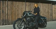 Cinemagraph Sexy Biker Girl Wearing Leather Jacket Sits On A Modern Motorcycle Stock Footage