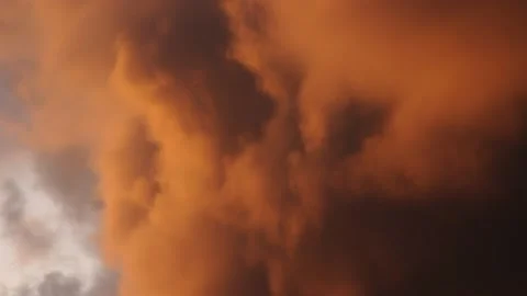 Cinemagraph slow motion of orange on fire clouds at sunset Stock Footage 151792545