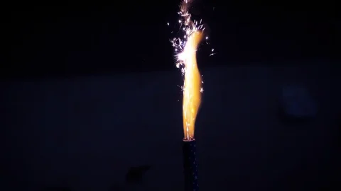Cinemagraph of sparks exploding on firework candle in the dark Stock Footage 130073193