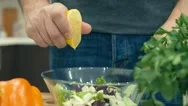 Cinemagraph - Squeezes The Lemon By Hand To Make A Salad. Stock Footage