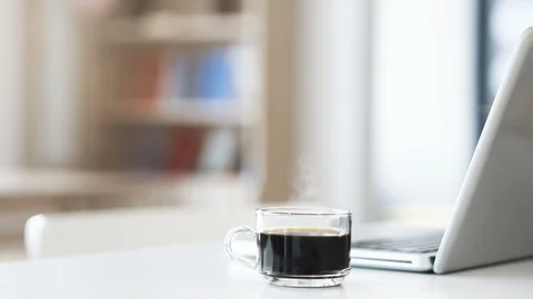 Cinemagraph of steaming coffee on working desk. Stock Footage 107510028
