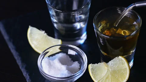 Cinemagraph, tequila is poured into a stack Video stock 143446657