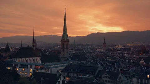 Cinemagraph time lapse of Zurich Old Town skyline at sunset. Church spires and Stock Footage 314361502