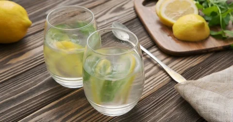 Cinemagraph - Two glasses with lemon drink. Motion Photo. Stock Footage 112638306