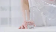 Cinemagraph - Water Pouring From A Pitcher Into A Glass. Stock Footage
