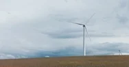 Cinemagraph. Wind Turbine Produce Electricity In The Field On A Windy Day Stock Footage
