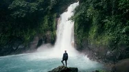 Cinemagraph Wonder Lust Of Man Enjoying Tropical Waterfall Stock Footage