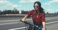 Cinemagraph Young Caucasian Girl With Brown Hair Sits On A Motorbike Stock Footage