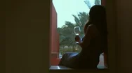 Cinemagraph - Young Woman Drinking White Wine On Outdoor Terrace . Stock Footage