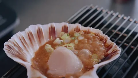 Cinematic 4K Closeup of Scallops Boiling on Mini Asian BBQ Stock Footage 317456821