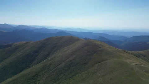 Cinematic 4K drone flight over mountain ridges – smooth aerial motion Stock Footage 343722243