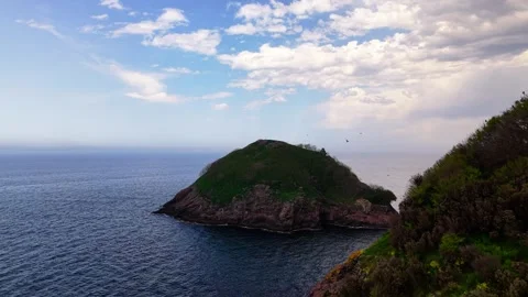 Cinematic 4K Drone Flight Through Tunnel Opening to Ocean Coastline Stock Footage 334325069