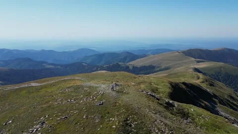 Cinematic 4K drone orbit around mountain peak – smooth aerial rotation Stock Footage 343720630