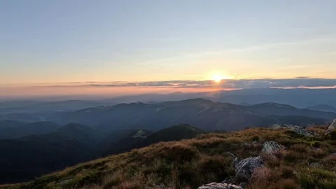 Cinematic 4K mountain sunset – clear golden hour light over ridge (static shot) Stock Footage 343723195