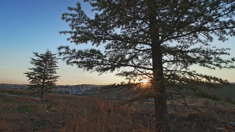 Cinematic 4K UHD Time Lapse of Sunset and Twilight Over Hill Stock Footage 320323542