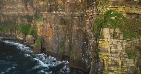 Cinematic aerial drone ascent along towering Cliffs of Moher above Atlantic Stock Footage 339503653