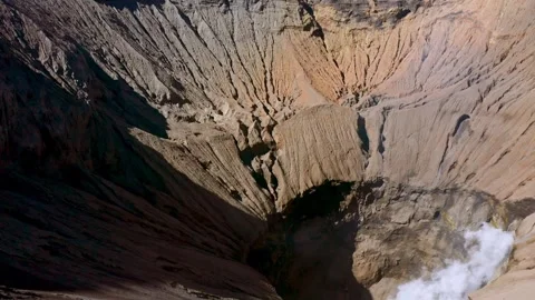 Cinematic Aerial Drone Flight Over The Rim Of Active Mount Bromo Volcano Video stock 332686997