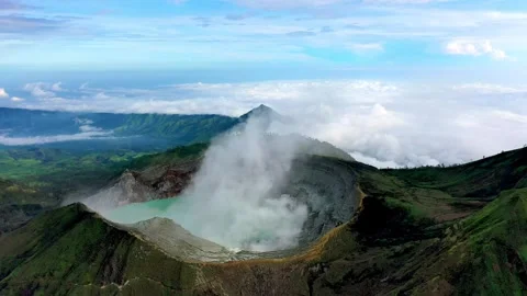 Cinematic Aerial Drone Flight Over The Rim Of Smoking Ijen Volcano Crater Java Video stock 333604015