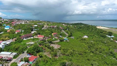 Cinematic Aerial Drone Pull-Back Reveal of Coastal Residential Area 4k Stock Footage 337638293