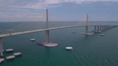 Cinematic aerial drone push toward Sunshine Skyway Bridge over Tampa Bay Stock Footage 334726604