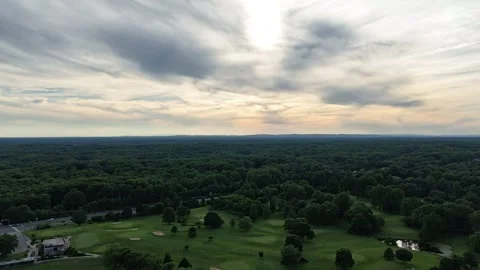 Cinematic Aerial Drone View over Golf Course and Dense Forest Horizon Vidéo 341936174