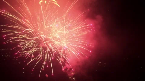 Cinematic aerial fireworks exploding in night sky Stock Footage 337057874