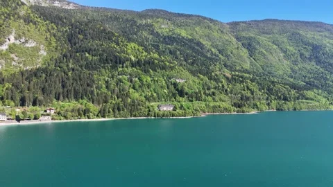 Cinematic Aerial Flight Facing Massive Alpine Ridges Above Lago di Molve Vídeo Stock 337863805