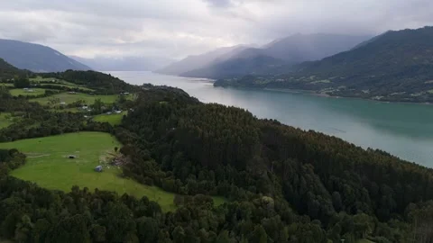 Cinematic Aerial Flight Over Remote Village and Fjord on Cloudy Day 库存影片 334320761