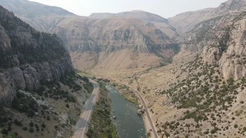 Cinematic aerial flight over Wind River and canyon highway Stock Footage 335009920