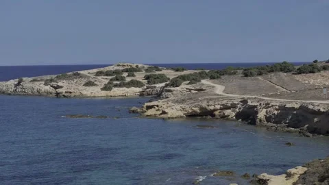 A Cinematic Aerial Flyover with Dynamic Push-In and Tracking Greece's Coastline Stock Footage 254084737