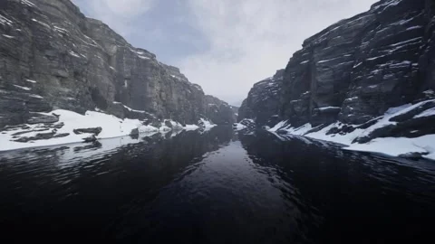 Cinematic Aerial Flyover of River Between Snow Mountains Stock Footage 327480030