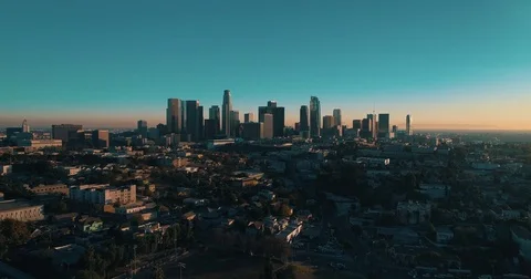 Cinematic aerial footage of downtown Los Angeles with skyline and street traffic Stock Footage