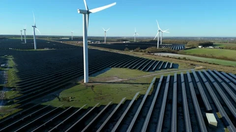 Cinematic aerial of huge solar and wind farm array, renewable energy UK. Stock Footage 326167553