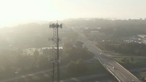 Cinematic Aerial Orbiting View of Cell Tower at Sunrise Stock Footage 95301719