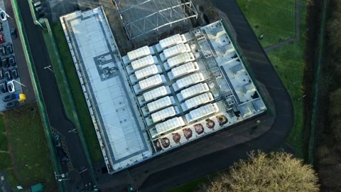 Cinematic aerial perspective of a large-scale data storage facility and Stock Footage 333541652