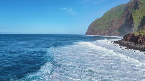 Cinematic Aerial Perspective of Ocean Waves Crashing on Achadas da Cruz Rocky Stock Footage 304575899